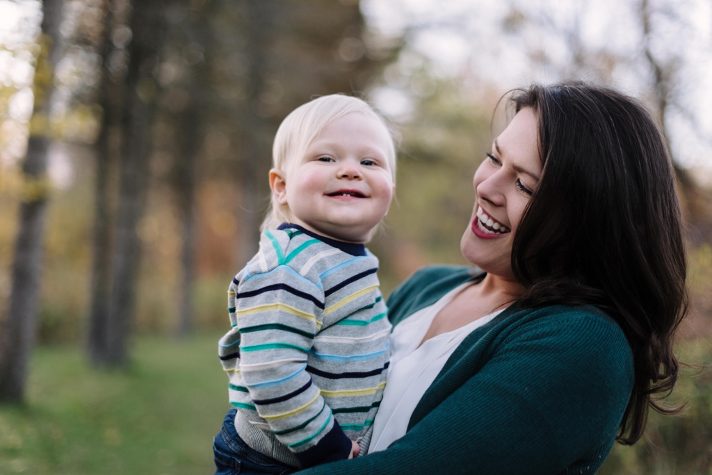 toddler and mom smiling at camera fall twin cities session
