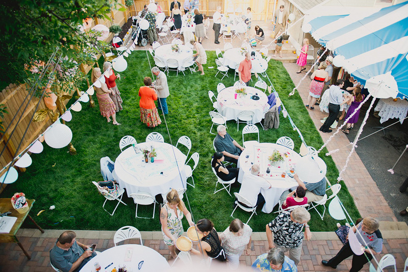 overhead image of wedding guests mingling in backyard