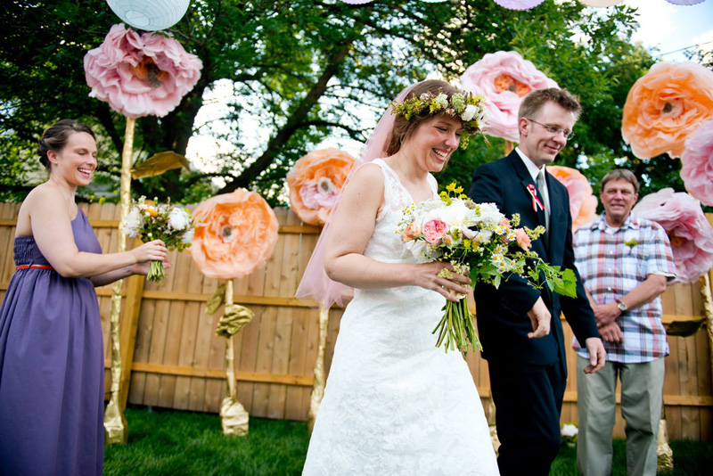 newlyweds leave backyard wedding ceremony