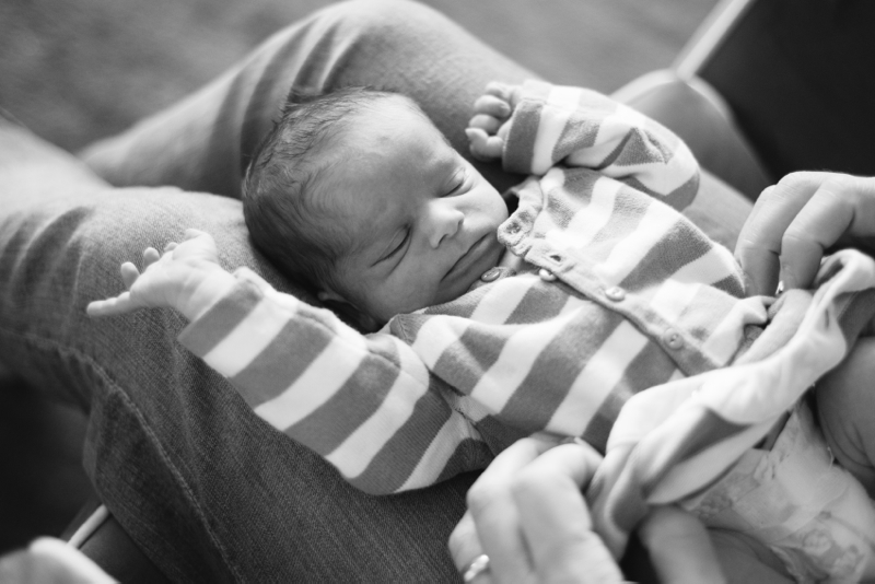 lifestyle newborn photograph baby stretching