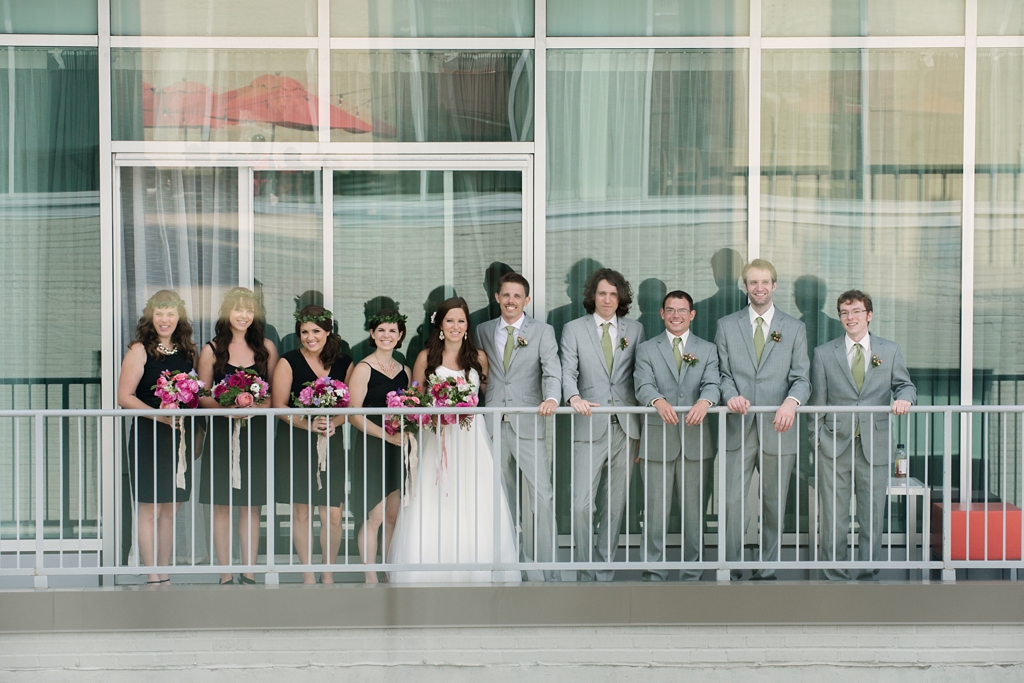 wedding party with bride and groom on minneapolis balcony