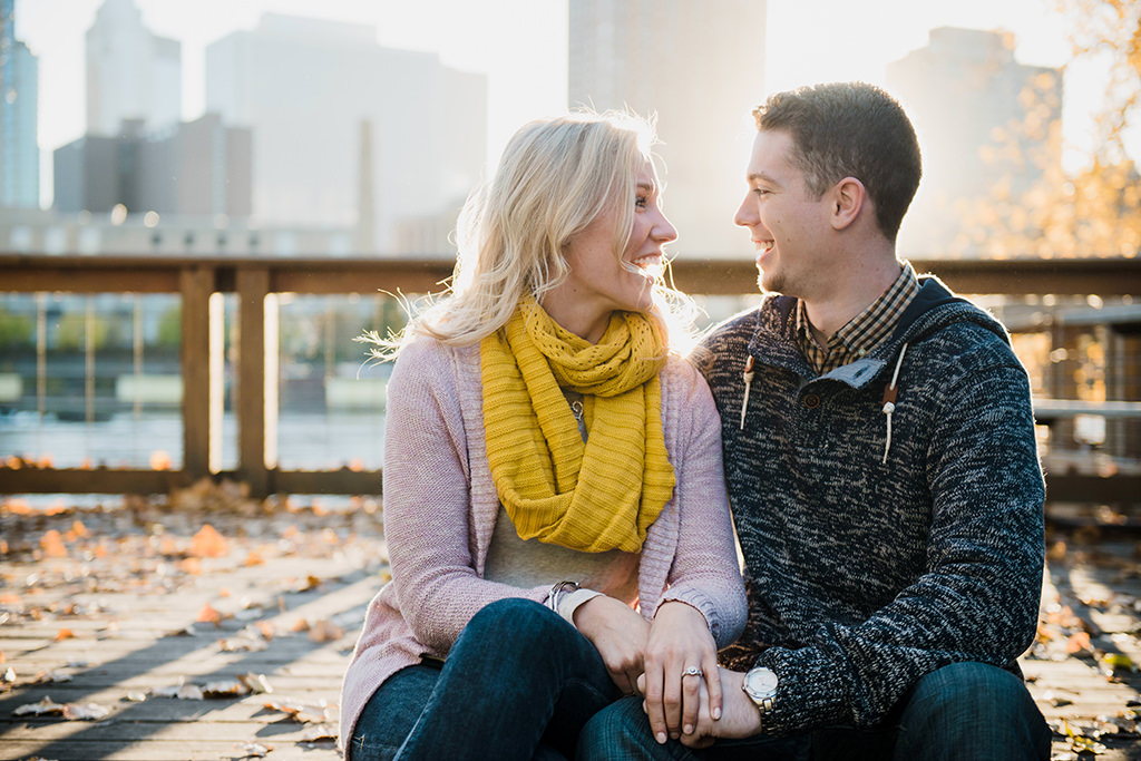 couple laughing beside mississippi river