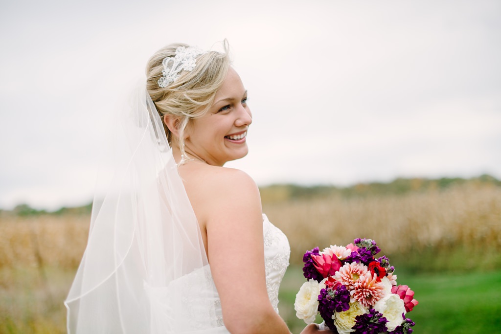 bride smiles over shoulder