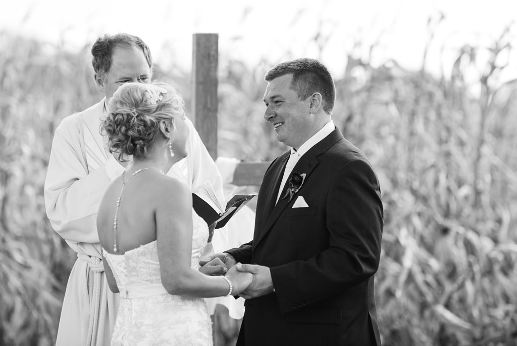 bride and groom exchange vows at outdoor wisconsin wedding