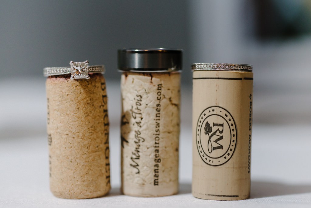 wine corks with wedding and engagement rings
