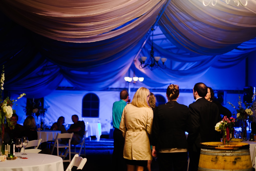 guests watch first dance with blue lights