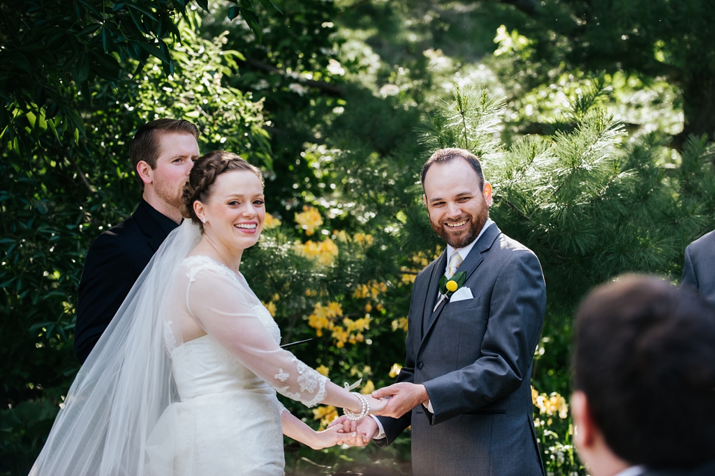exchanging vows at chaska mn arboretum wedding