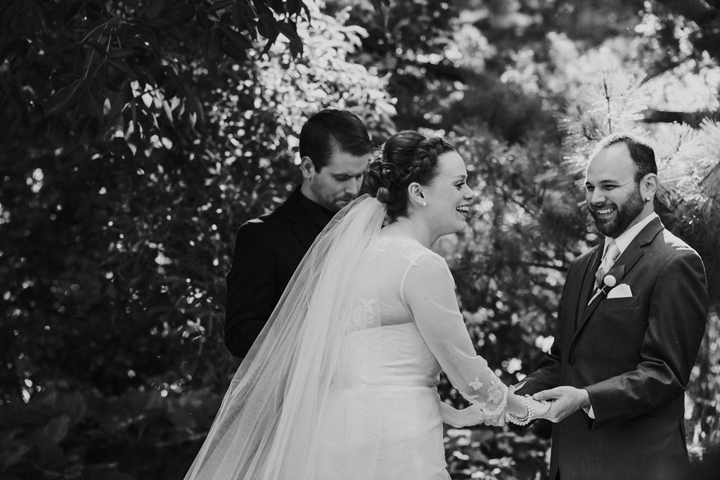 bride and groom laugh during arboretum ceremony