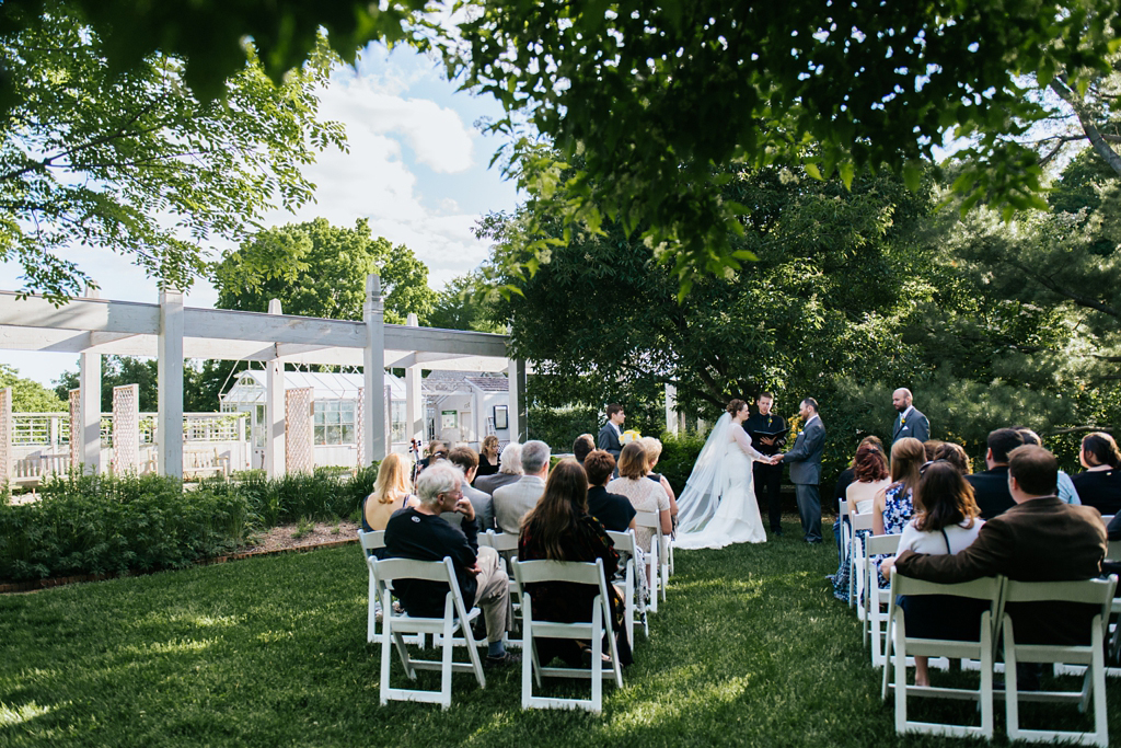 Wedding ceremony at the Minnesota Arboretum gardens with chairs outdoors