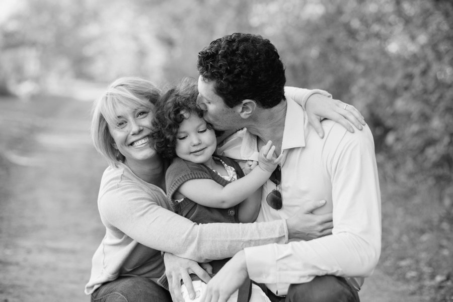 family hugging in black and white at outdoor family session