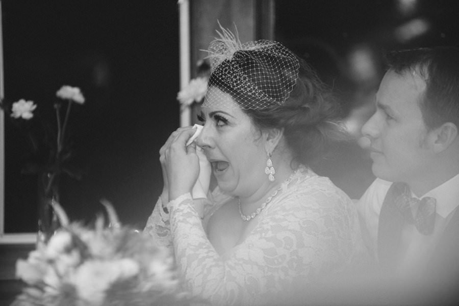 Candid Wedding Photography in the Twin Cities, Bride is moved by Speeches