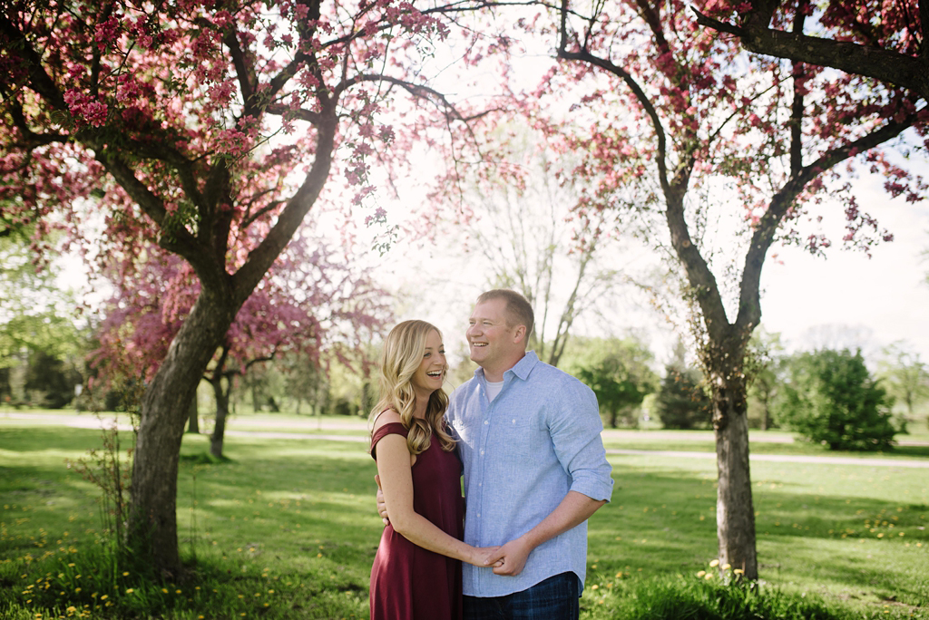 spring engagement session under blossoming trees