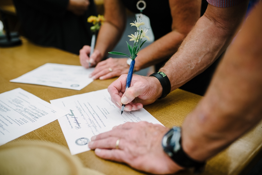 couple signing wedding certificate minnesota