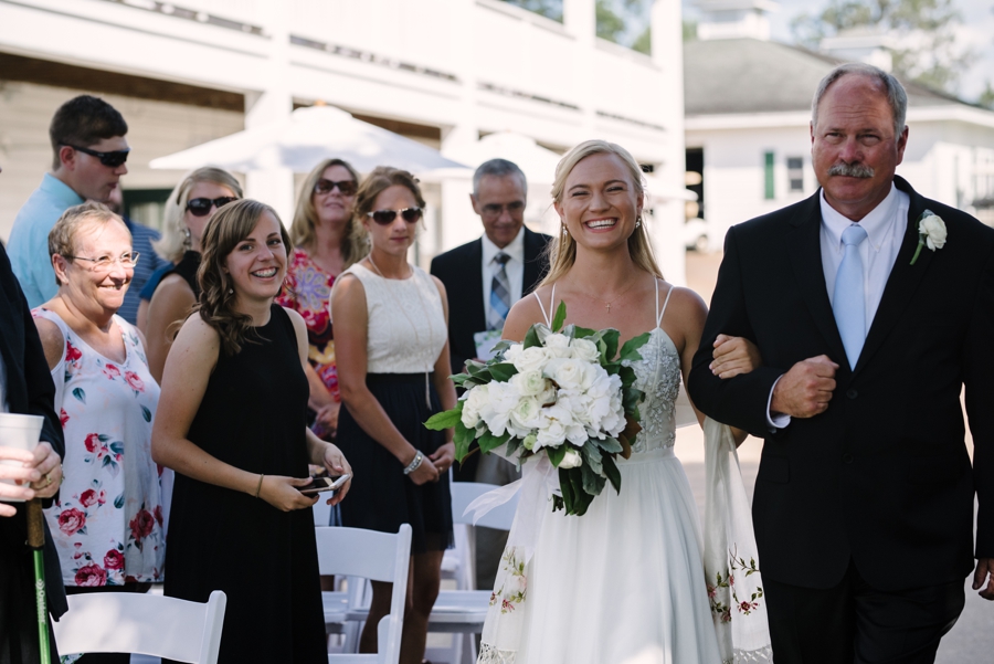 bride walked down the aisle by her father