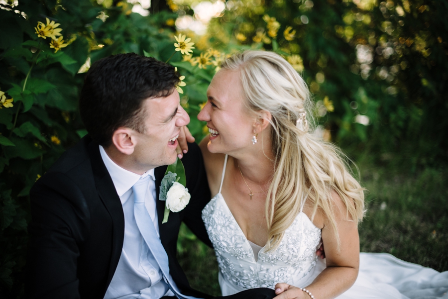 bride and groom laughing together 