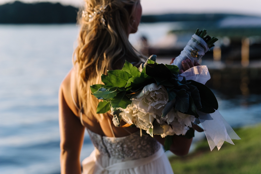 bride holding her bouquet over her shoulder