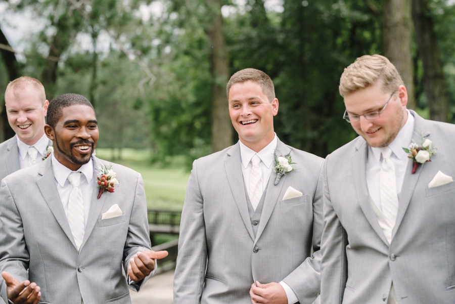 groom and groomsmen laughing before wedding