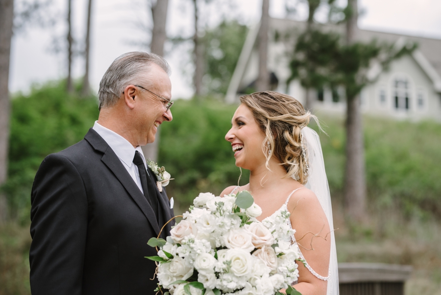 father of bride and bride laughing in saint croix wisconsin