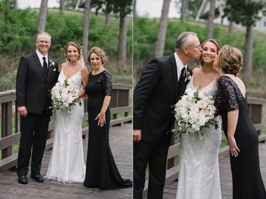 bride with her parents and parents kissing her cheeks