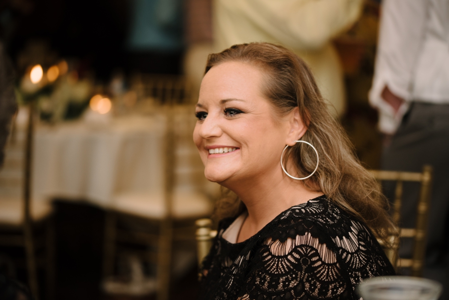 wedding guest smiling at reception