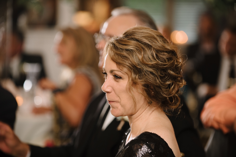 mother of bride smiling at reception 