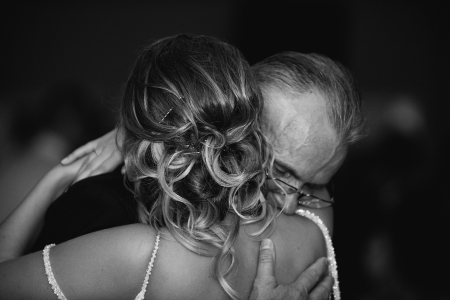 bride hugging her father during dance at reception 