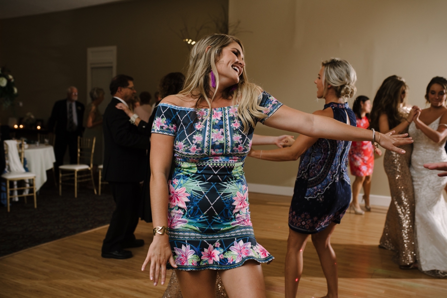 wedding guests dancing at wedding reception 