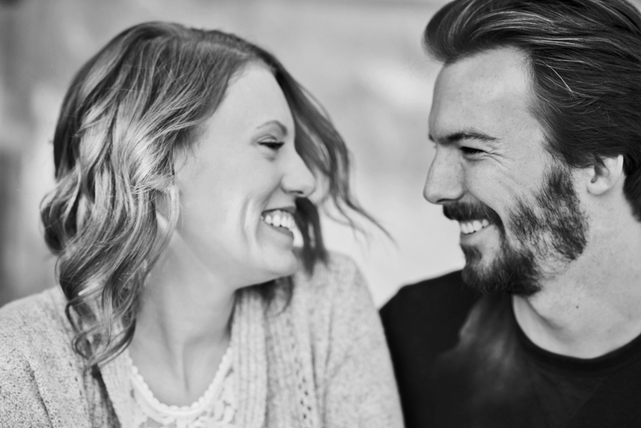 Candid Portraits of engaged couple laughing