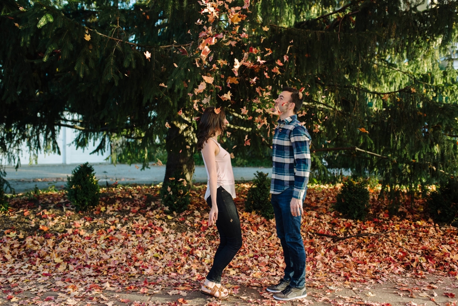 Midwest Fall Engagement Photos with Leaves in the air
