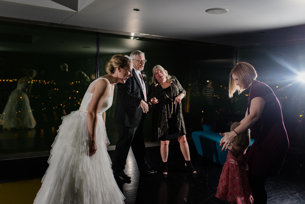 Guests and bride happily dancing at Guthrie Wedding reception