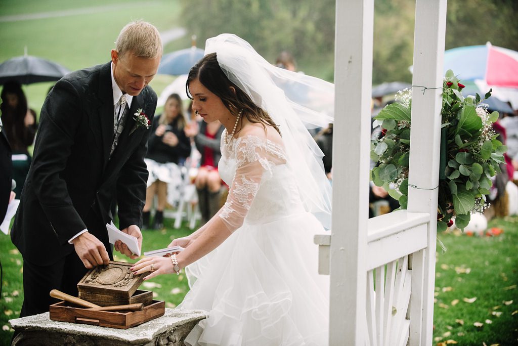 Bride and groom do A Love Letter and Wine Box during MN ceremony