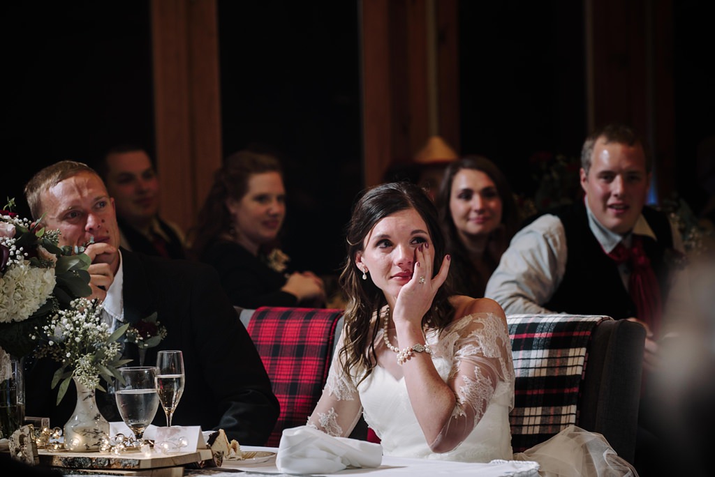 bride reacts with tears to wedding speeches in Minnesota