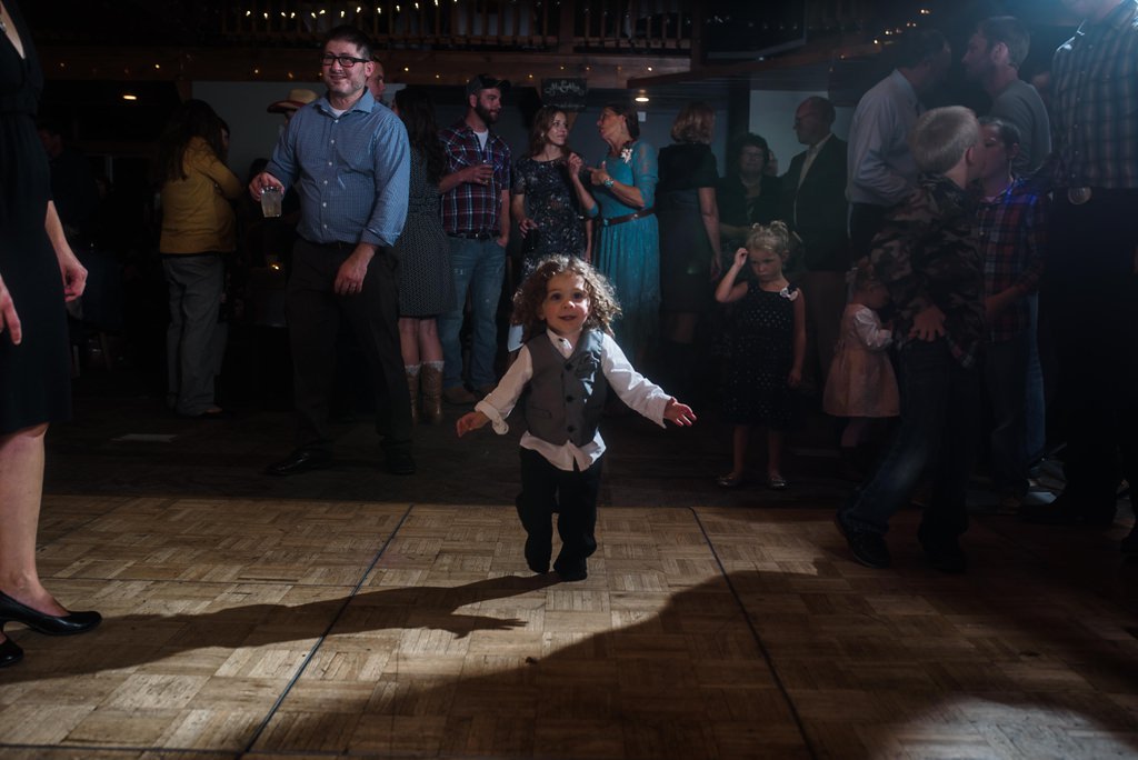 Little boy dancing in the wedding reception