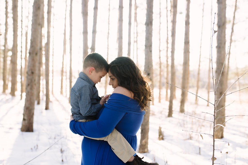 intimate maternity session in minnesota woods