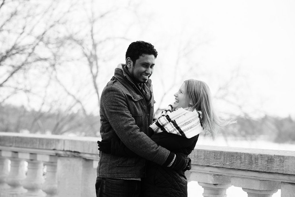 winter engagement session couple laughing outside