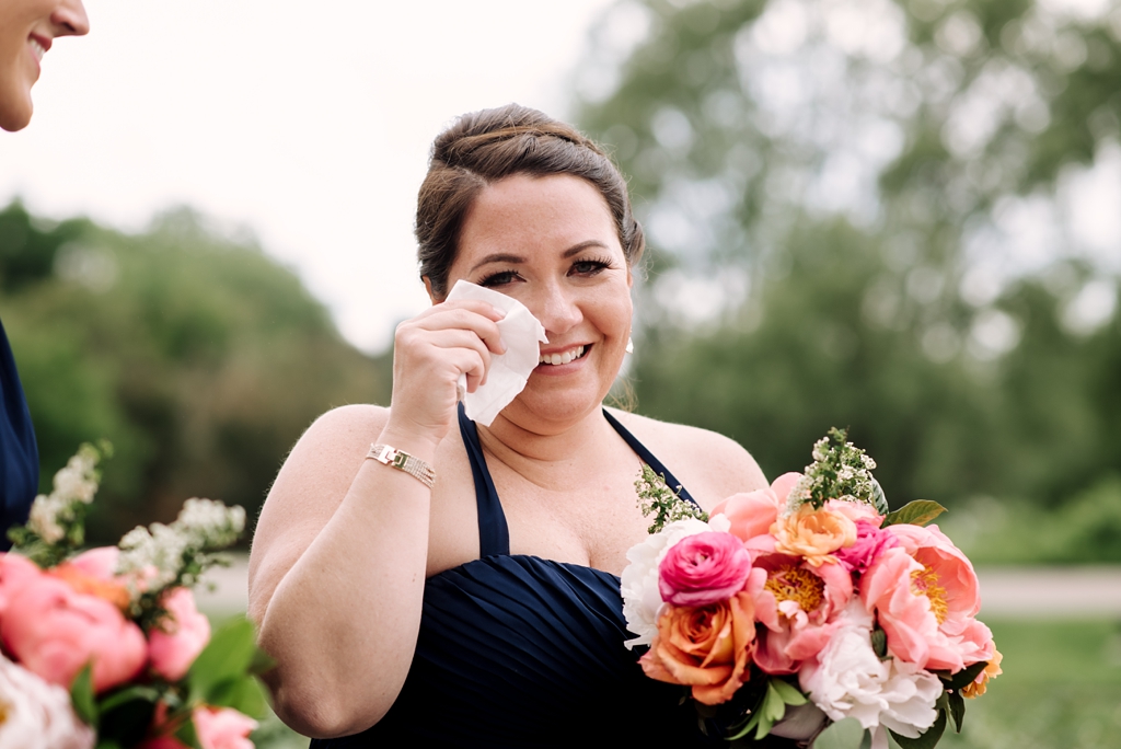 bridesmaid crying happy tears at outdoor minnesota wedding