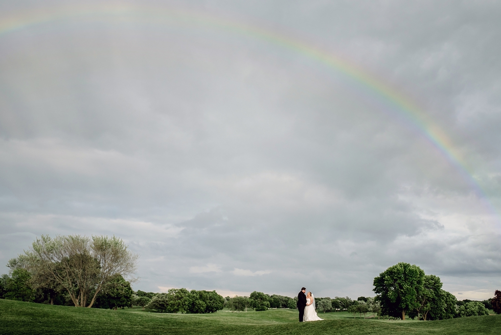 natural rainbow on wedding day during portraits