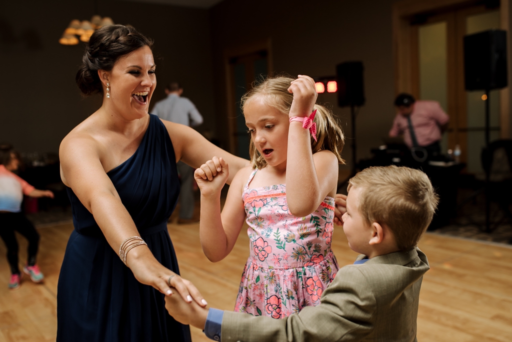 bridesmaid and children dance at wedding reception