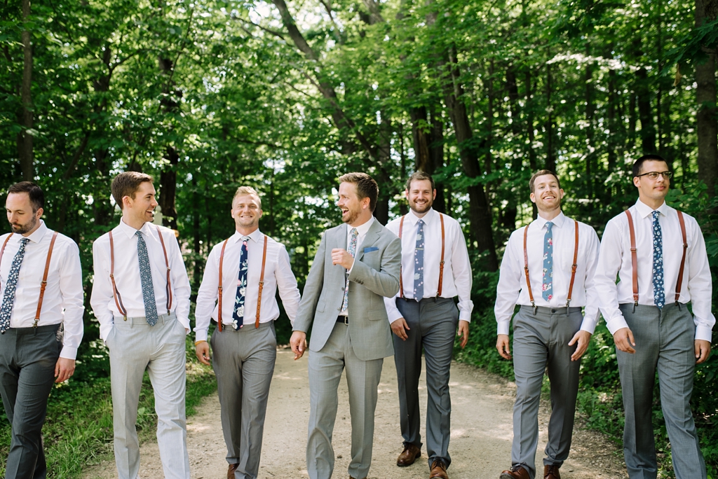 groom and groomsmen portrait with fun ties