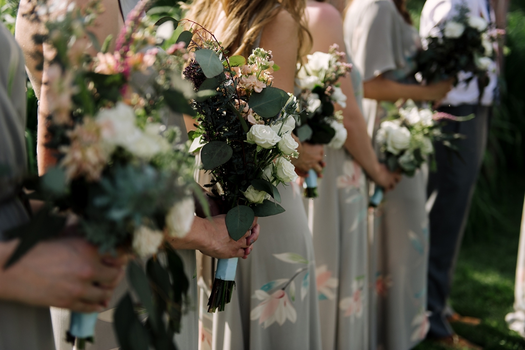 bridesmaids holding bouquets at outdoor wisconsin wedding