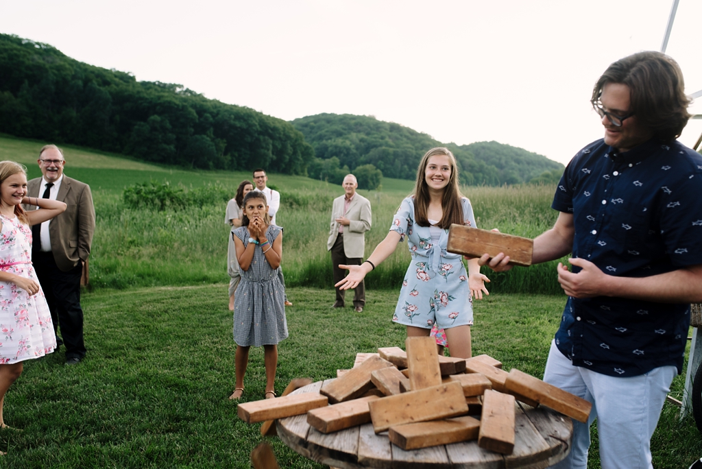 wisconsin barn wedding guests playing giant jenga