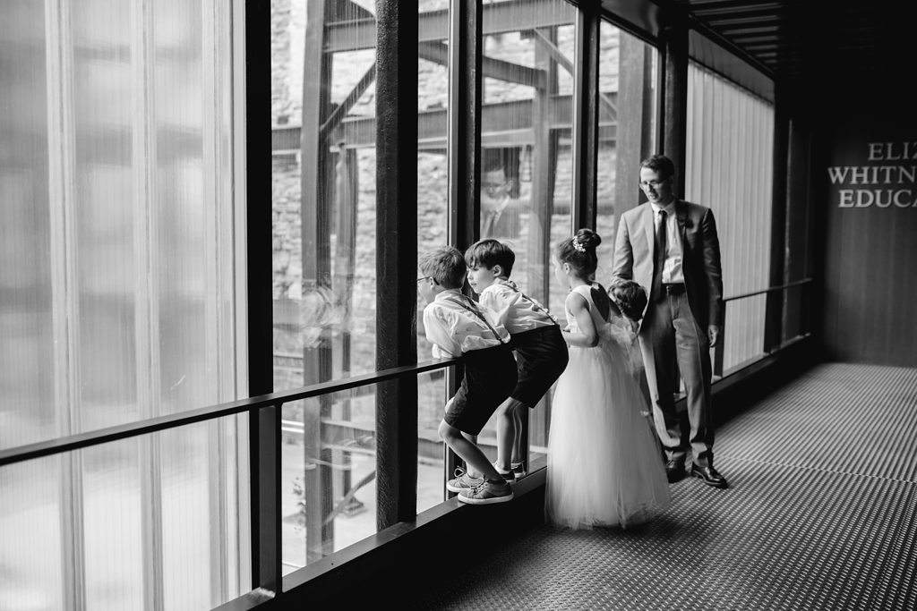 kids at wedding looking out mill city museum windows