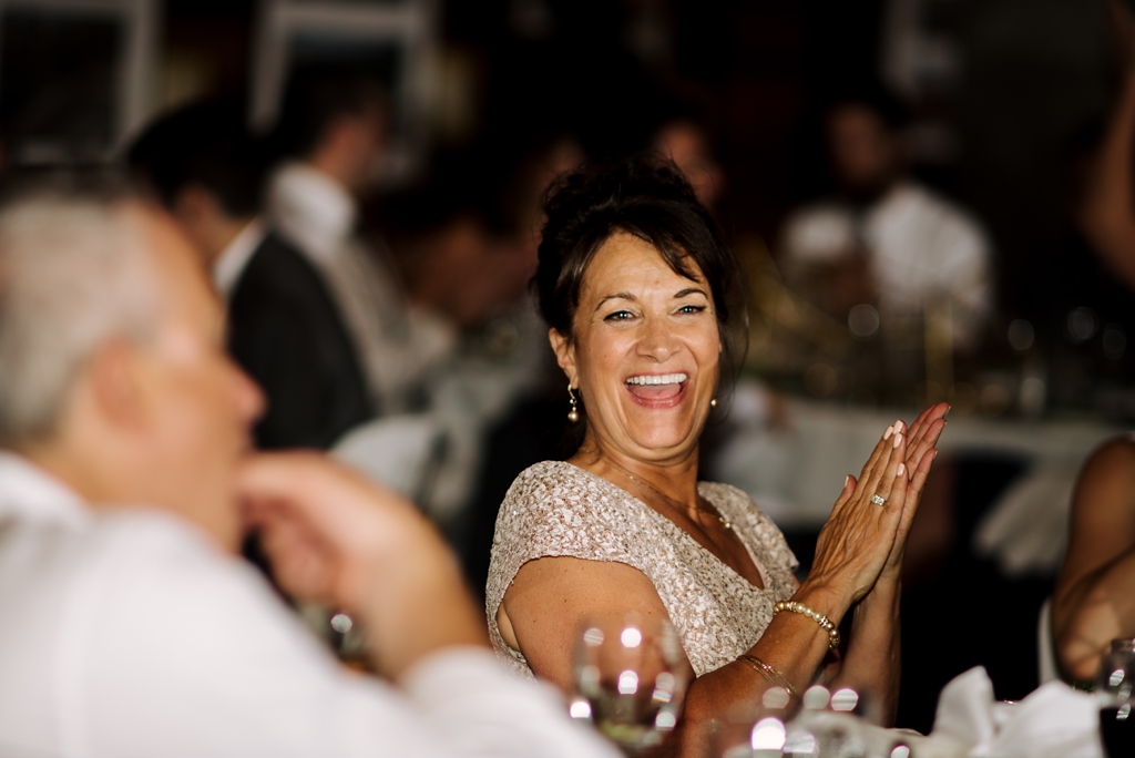 wedding guest clapping at reception