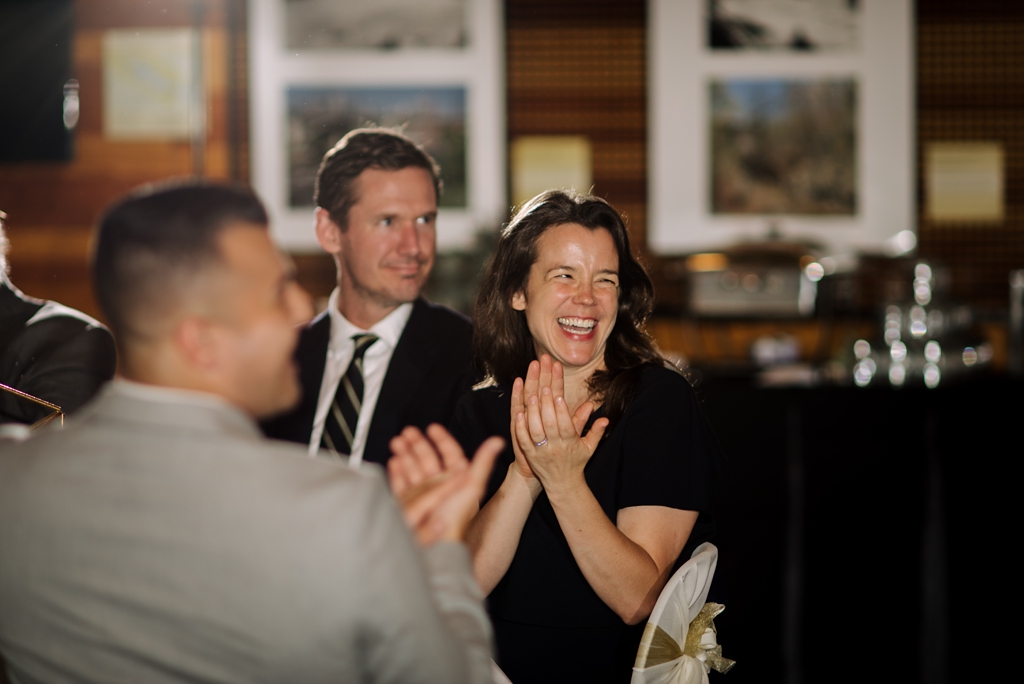 wedding guests clapping at reception