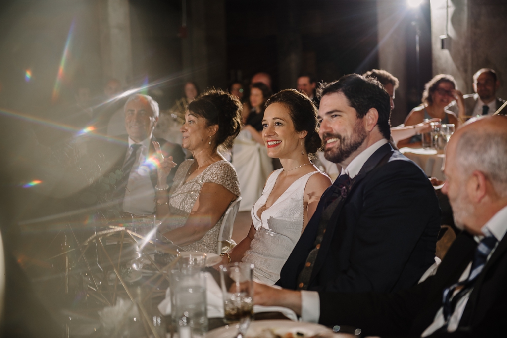 bride and groom at reception with lens flares