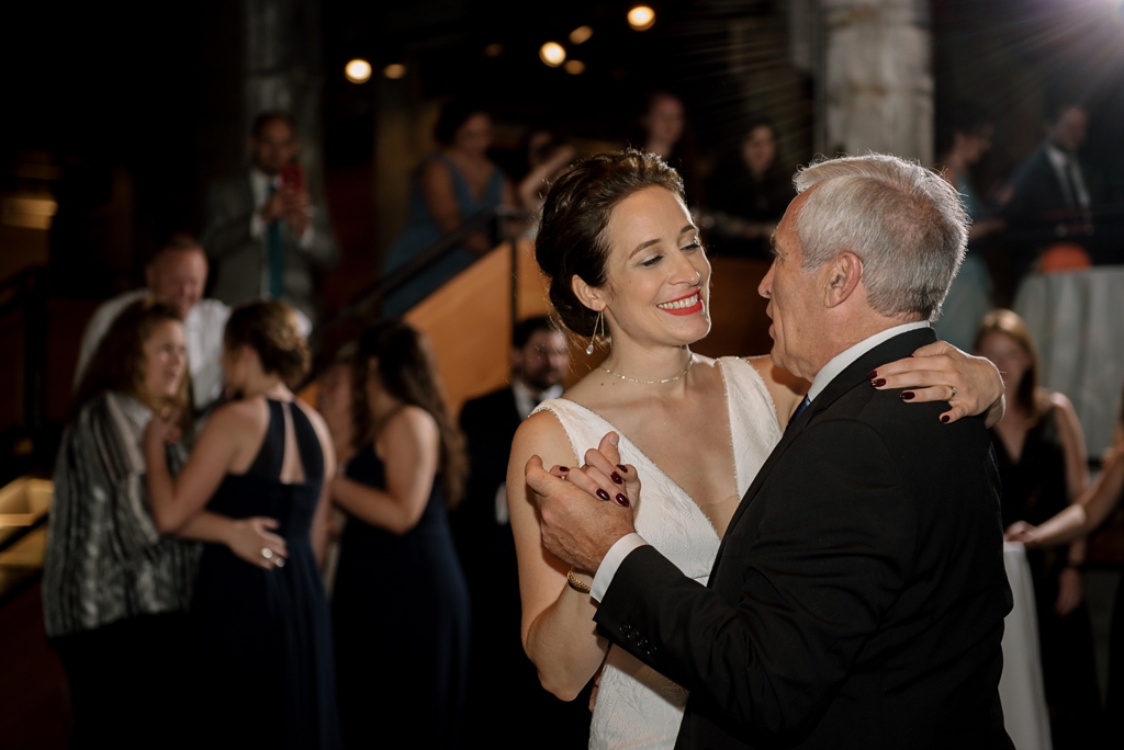 bride dances with father during wedding reception