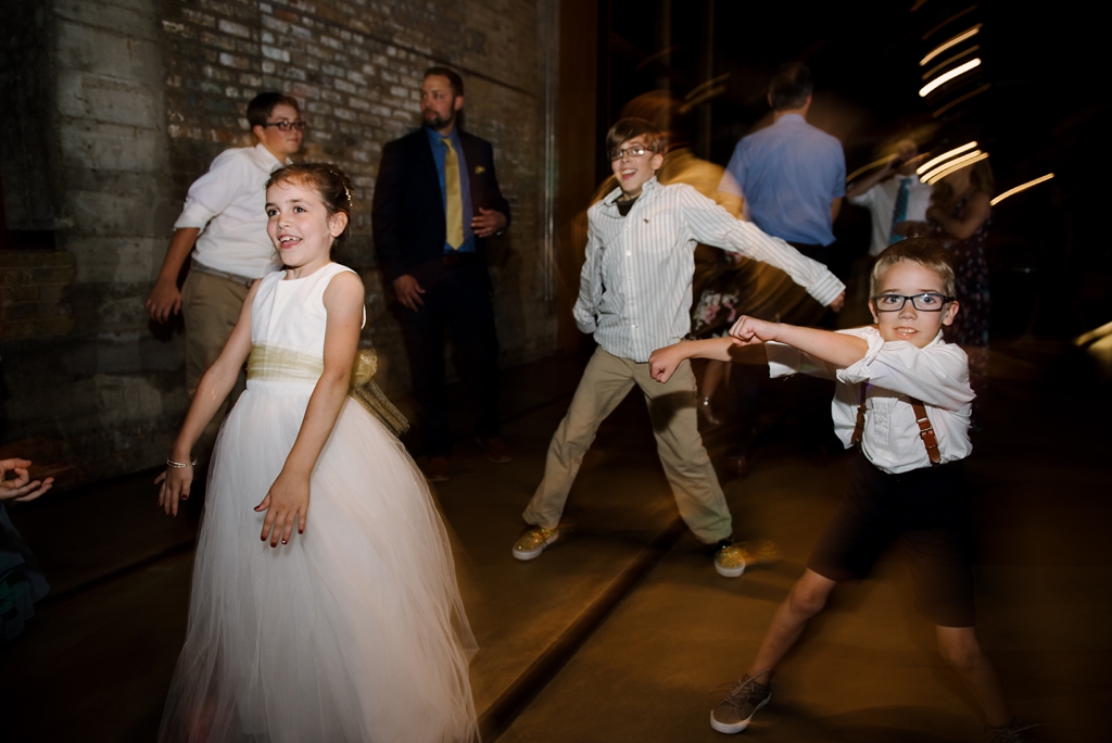children dancing at mill city museum wedding reception
