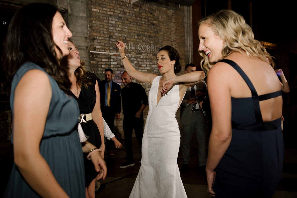 bride dances at mill city museum wedding reception