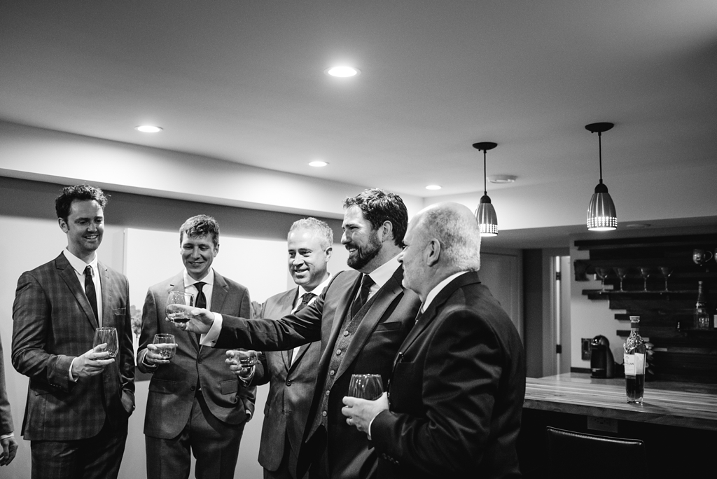 Groom toasts with groomsmen before Minneapolis Wedding