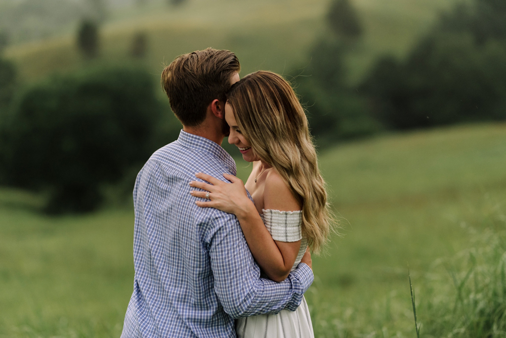minnesota engaged couple in green field